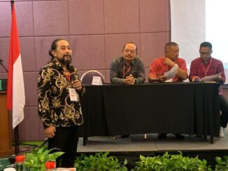 Lan Ananda saat menyampaikan pidato sesaat setelah terpilih sebagai ketua DPD PKHI Bali pada Musda PKHI Bali, Minggu (9/11/2025) di Hotel Ibis Style, Denpasar - IST