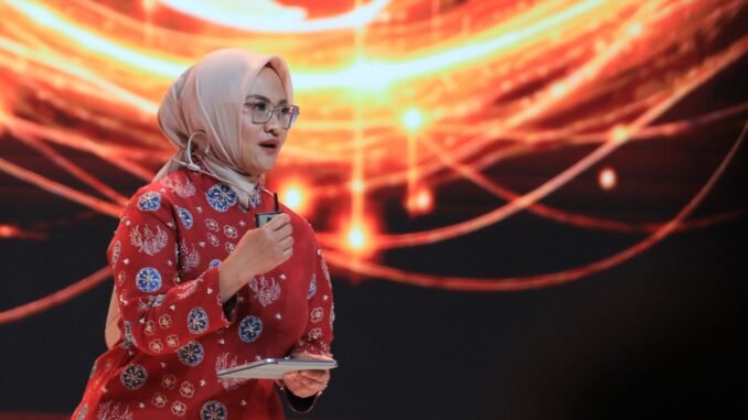Direktur Utama Telkom Dian Siswarini memberikan opening speach dalam Bali Annual Telkom International Conference di Bali International Convention Center, Nusa Dua, Bali, Rabu (26/8/2026). - IST
